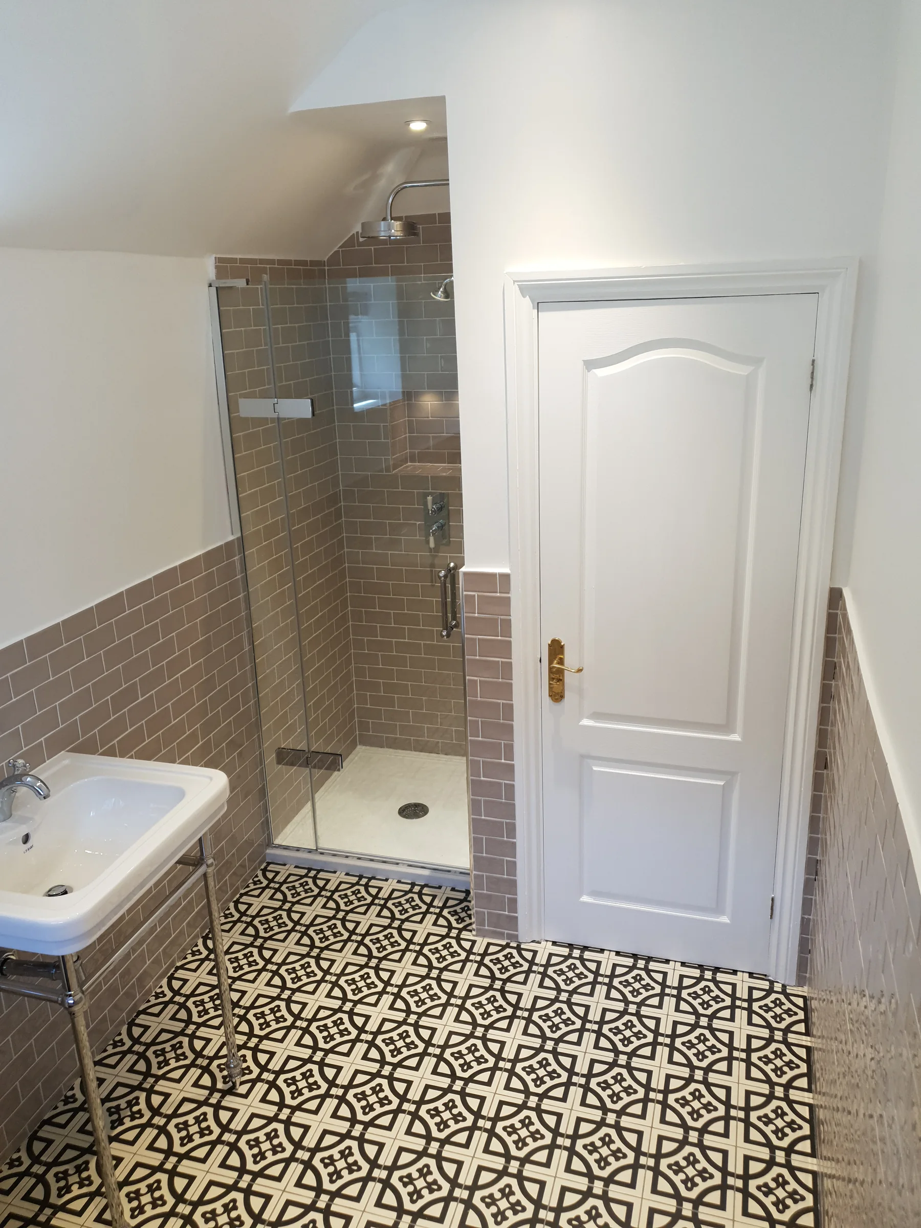 Period bathroom with patterned floor tiles